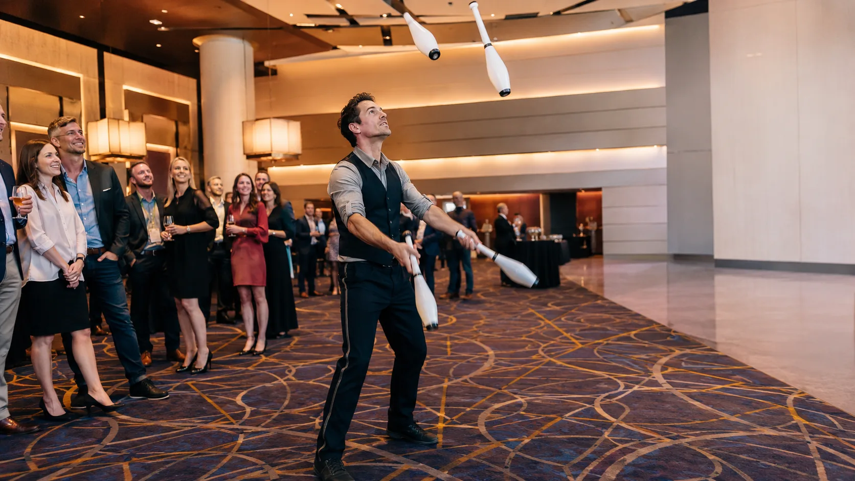 Roving circus performers entertaining a busy event crowd in the US