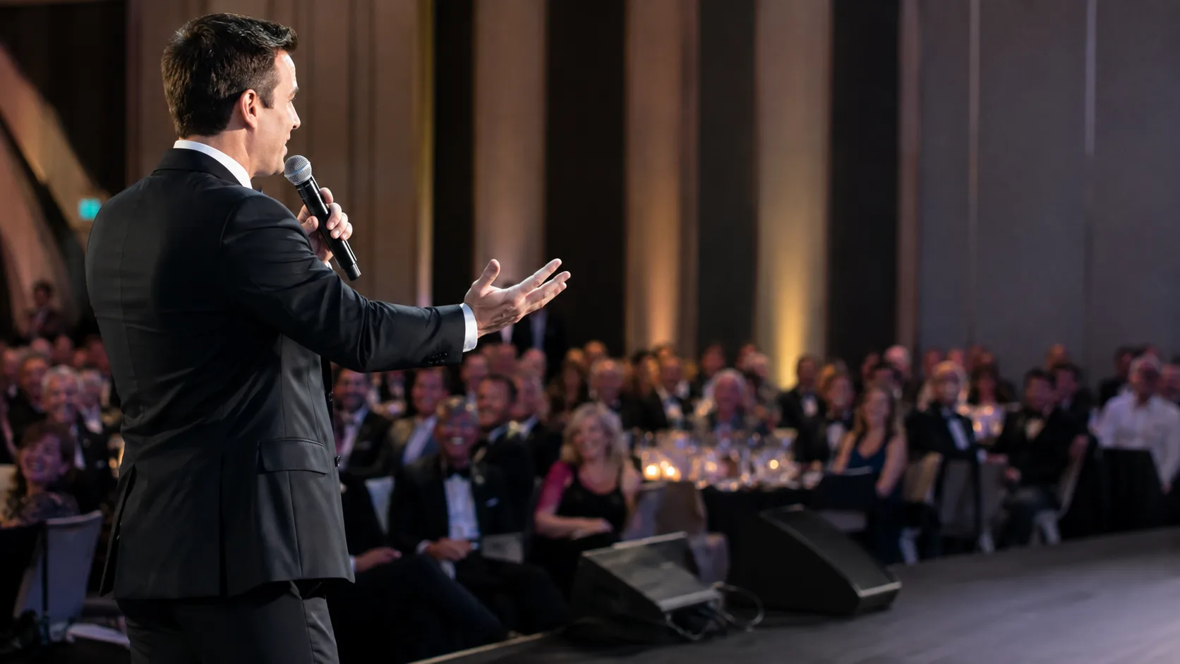 Comedian or MC engaging a seated event audience live in the US