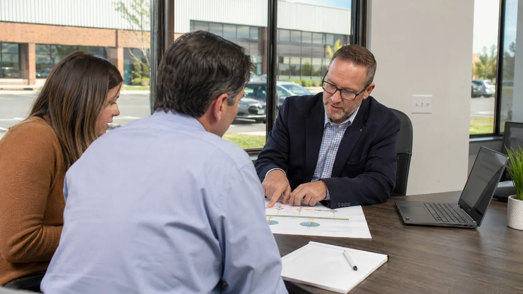 A financial adviser holds a planning review with a client in the US
