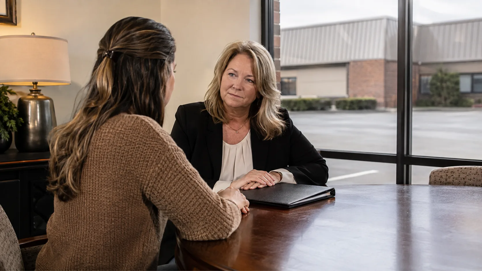 A funeral director listens during a private family appointment in the US